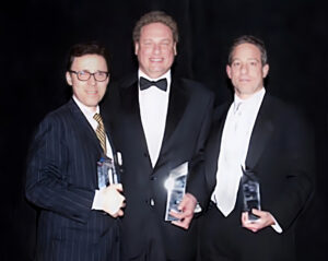 Acting Chairman of the New York Industrial Agency, Derek Bryson Park; President of the New York Yankees Baseball Club, Randy Levine; and Executive Vice President and Chief Legal Officer of the New York Mets, David Cohen; receiving The Bond Buyer’s Deal of the Year Award for the Agency’s sale of $1.6 billion of bonds to finance new ballparks for both teams in the Bronx and Queens, New York, NY