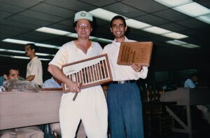 Derek Bryson Park alongside the manager of the General Cigar Dominicana factory in the Santiago, Dominican Republic.