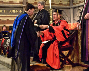 Derek Bryson Park shaking hands with the Dean of the General Theological Seminary of the Episcopal Church, The Very Reverend Ward B. Ewing