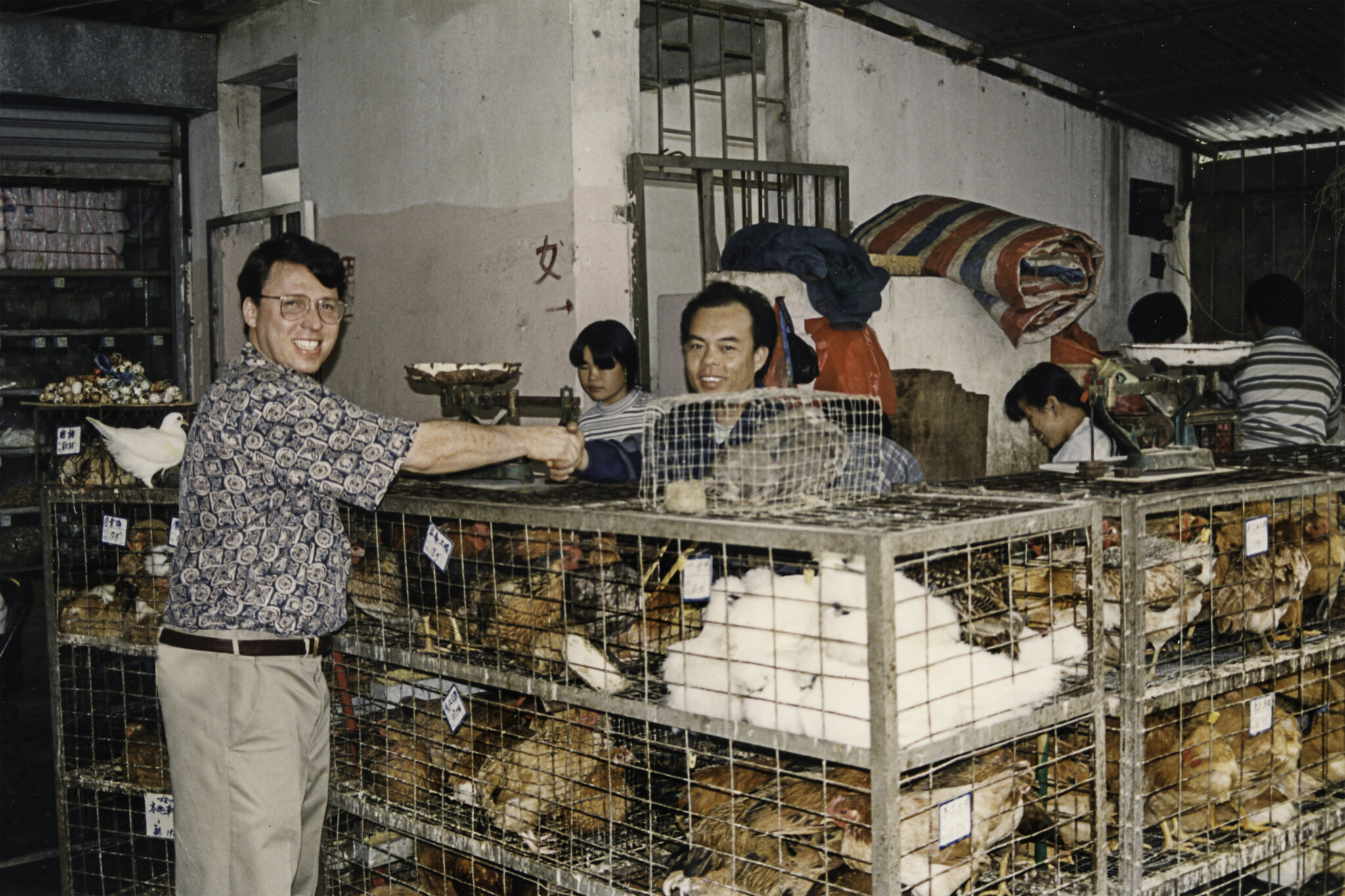 Derek Bryson Park being received by the owner of multiple live poultry markets, Guangzhou, Guangdong Province, China