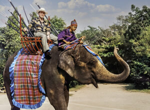 Derek Bryson Park shares a moment with a rescued elephant in Nong Chok, Thailand