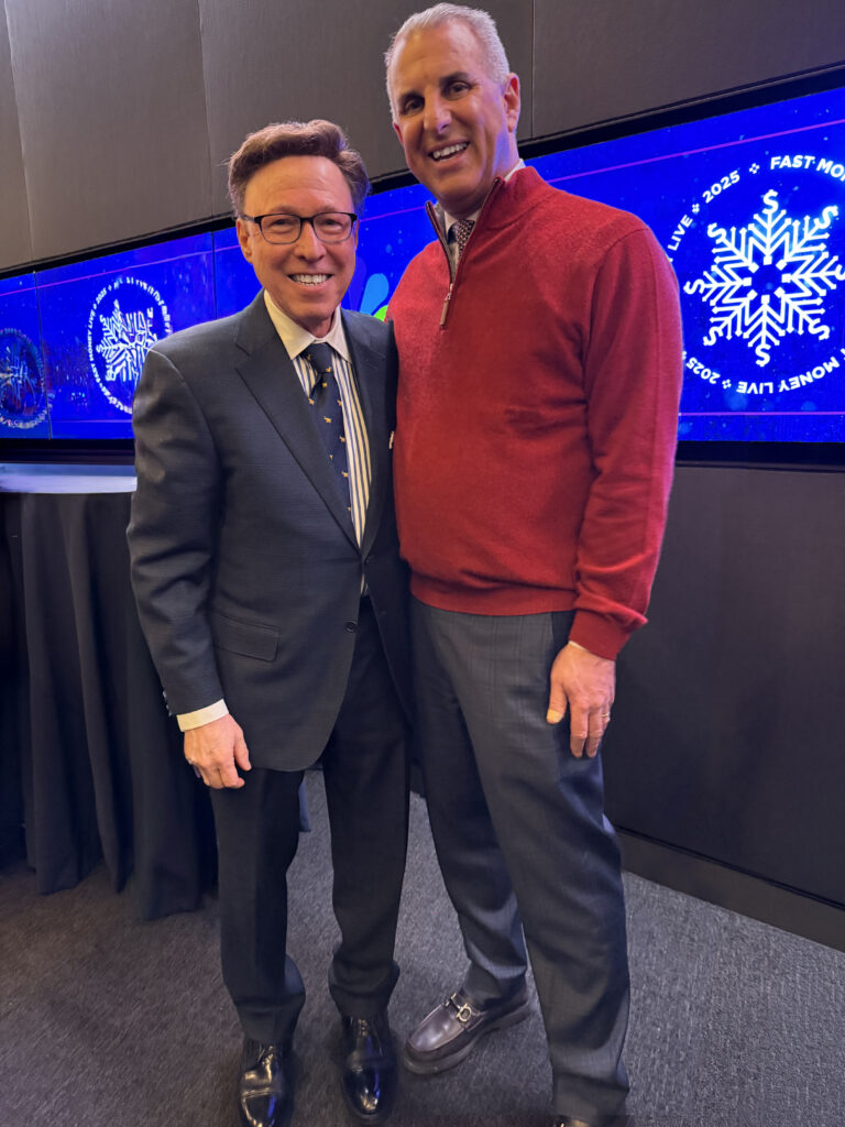 Derek Bryson Park and Co-founder of RiskReversal Media, Guy Adami, at Nasdaq MarketSite in Times Square, New York
