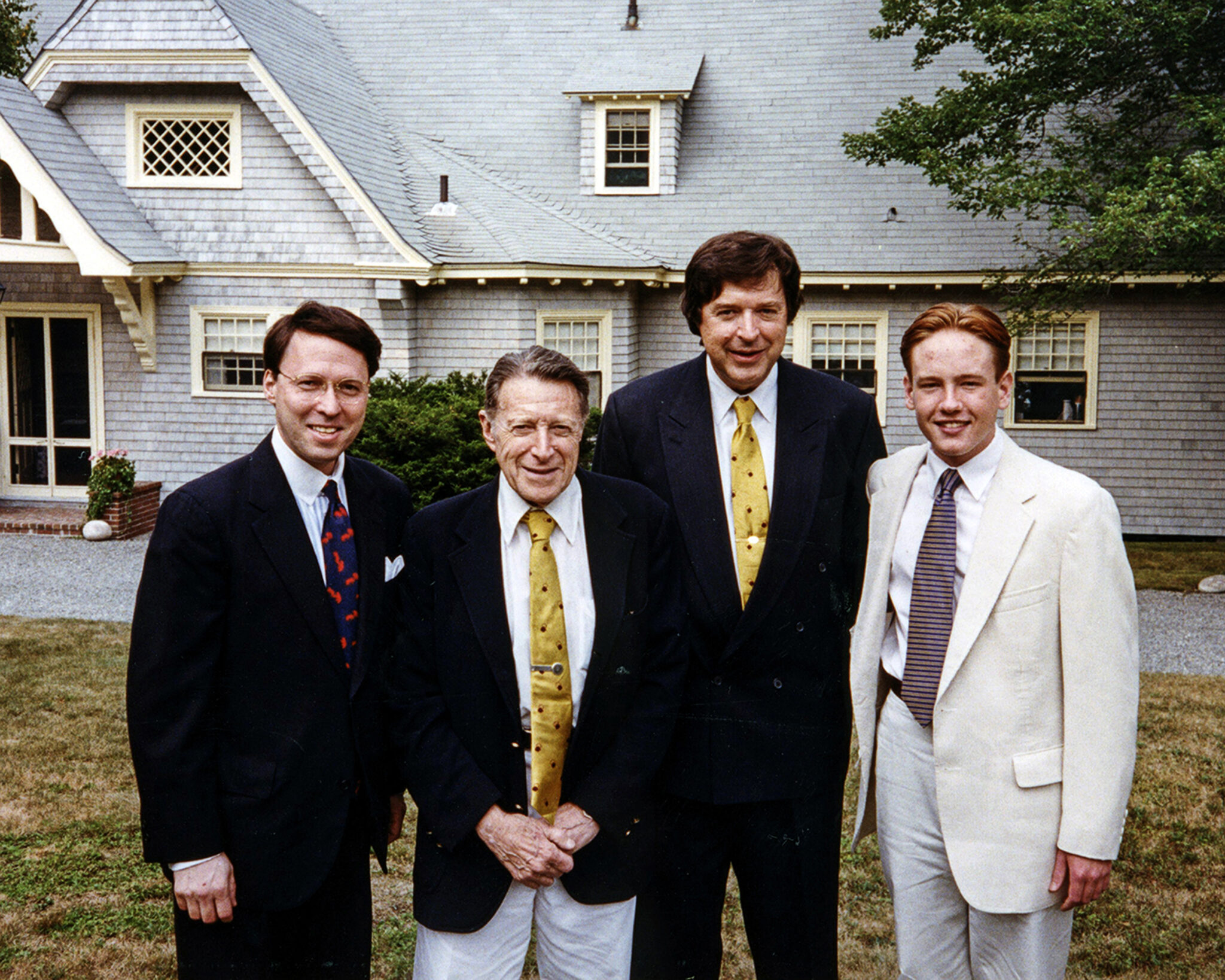 Three generations of the Weinberger lineage gather at their family retreat on Mt. Desert Island, Maine: (from left) Derek Bryson Park; the elder Caspar Weinberger, a towering figure of the American Century; his son, Caspar Weinberger Jr., who served as Director of the New York Office of the Federal International Communications Agency; and his grandson, James Weinberger. Known as "Cap the Knife" for his fiscal discipline, the elder Weinberger’s storied career in Washington spanned three presidencies, serving under President Richard Nixon as Chairman of the Federal Trade Commission, Director of the Office of Management and Budget, and Secretary of Health, Education, and Welfare—a post he continued under President Gerald Ford—before his defining tenure under President Ronald Reagan as Secretary of Defense, where he oversaw the largest peacetime military buildup in U.S. history.
