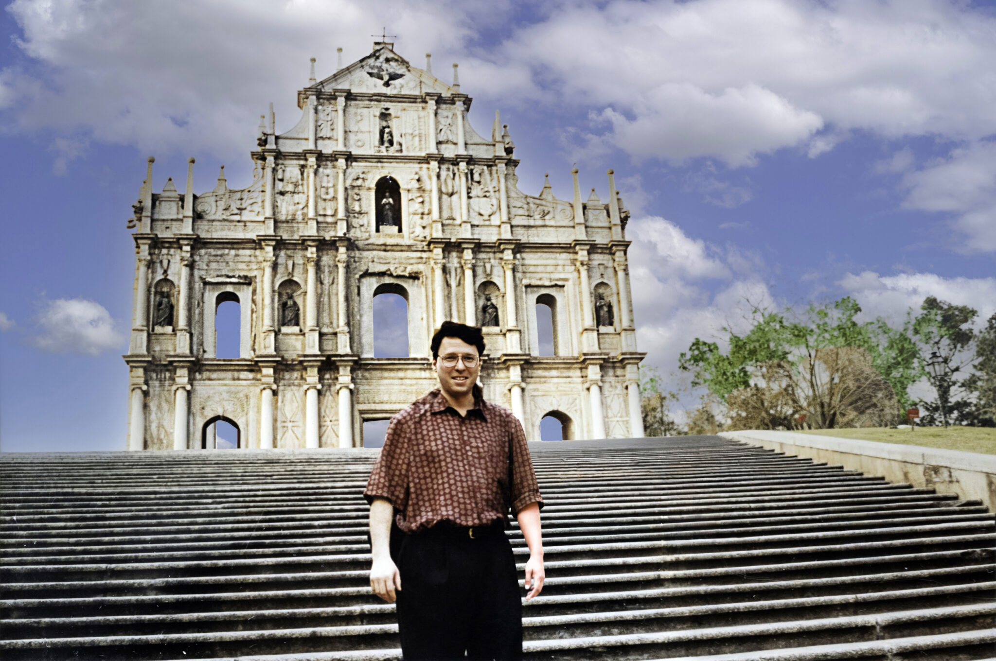 FROM COLONIAL ENCLAVE TO GAMING TITAN: STRATEGIC SHIFTS AT THE <a href="https://en.wikipedia.org/wiki/Ruins_of_Saint_Paul%27s" target="_blank">RUINS OF ST. PAUL'S</a>: Derek Bryson Park standing before the 17th-century facade of the Ruins of St. Paul's in <a href="https://en.wikipedia.org/wiki/Macau" target="_blank">Macau</a>, the intersection of history and high-stakes finance is profound. Formerly the <a href="https://en.wikipedia.org/wiki/Portuguese_Macau" target="_blank">Portuguese Territory of Macau</a>—which legalized gambling in 1847—the region officially transitioned to the <a href="https://en.wikipedia.org/wiki/Macau_Special_Administrative_Region" target="_blank">Macau Special Administrative Region (SAR)</a> of the People’s Republic of China on <a href="https://en.wikipedia.org/wiki/Transfer_of_sovereignty_over_Macau" target="_blank">December 20, 1999</a>. Since <a href="https://en.wikipedia.org/wiki/Gambling_in_Macau" target="_blank">liberalizing its gaming industry in 2002</a>, this tiny enclave has eclipsed <a href="https://en.wikipedia.org/wiki/Las_Vegas" target="_blank">Las Vegas</a> to become the world’s undisputed gambling capital, with casino revenues driving a robust economy that dwarfs its 32-square-kilometer size.